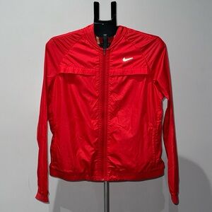 NIKE WOMENS RUNNING JACKET  LARGE.